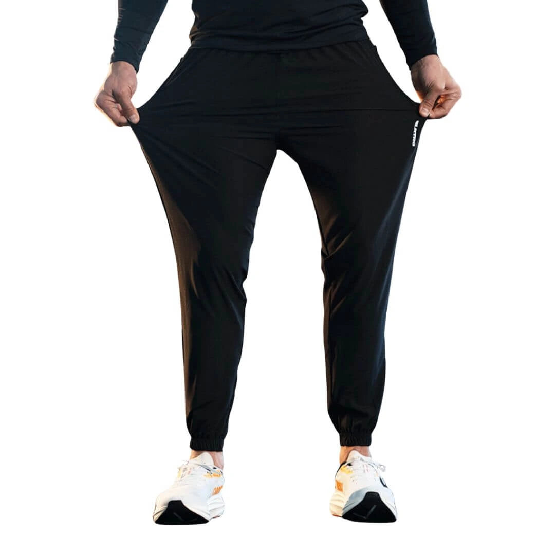 calça para academia em tecido elastano, calça na cor cinza com uma listra na cor preta