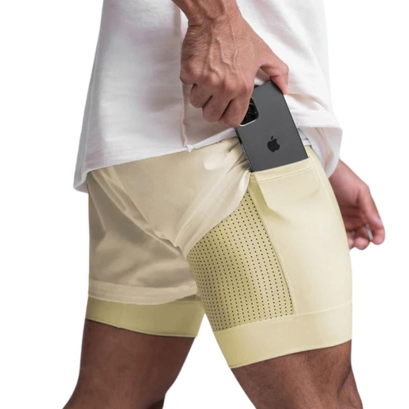 Short de compressão masculino amarelo claro com bolso lateral para celular, tecido elástico e respirável para treino intenso
